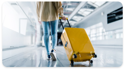 A passenger walking at the airport terminal